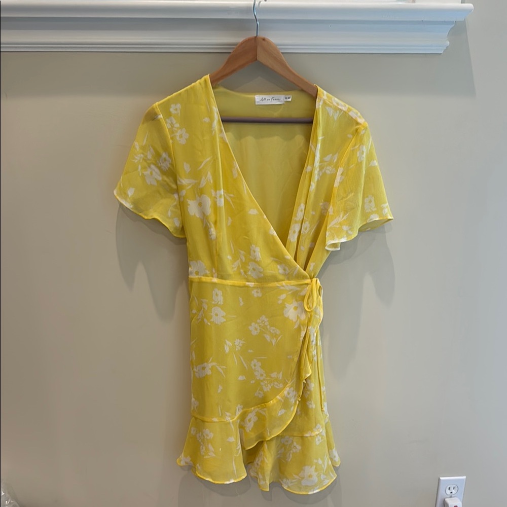 All in Favor Yellow Flutter Sleeve Wrap Blouse